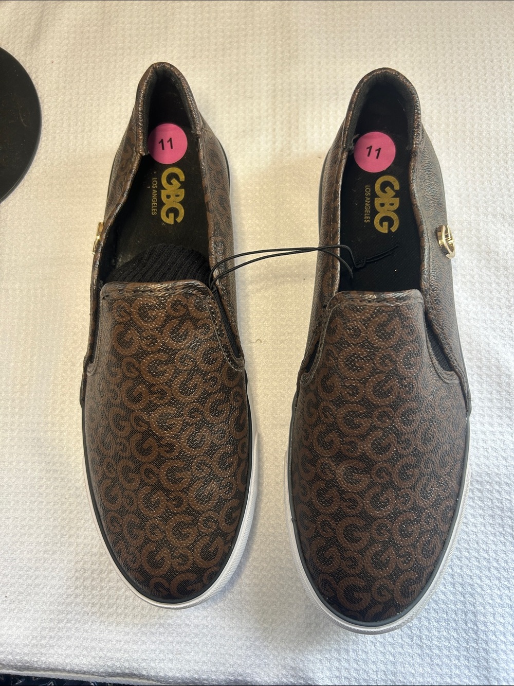 GBG Los Angeles Brown Monogram Slip-On Sneakers